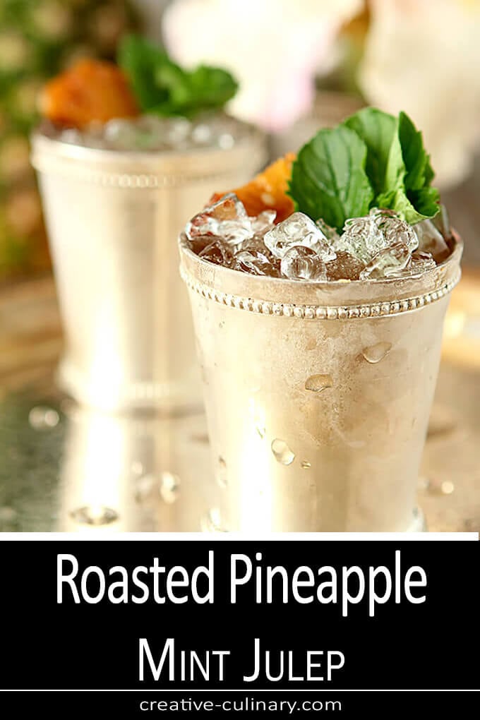 Rum Served the standard silver mint julep cup with mint and pineapple garnish.