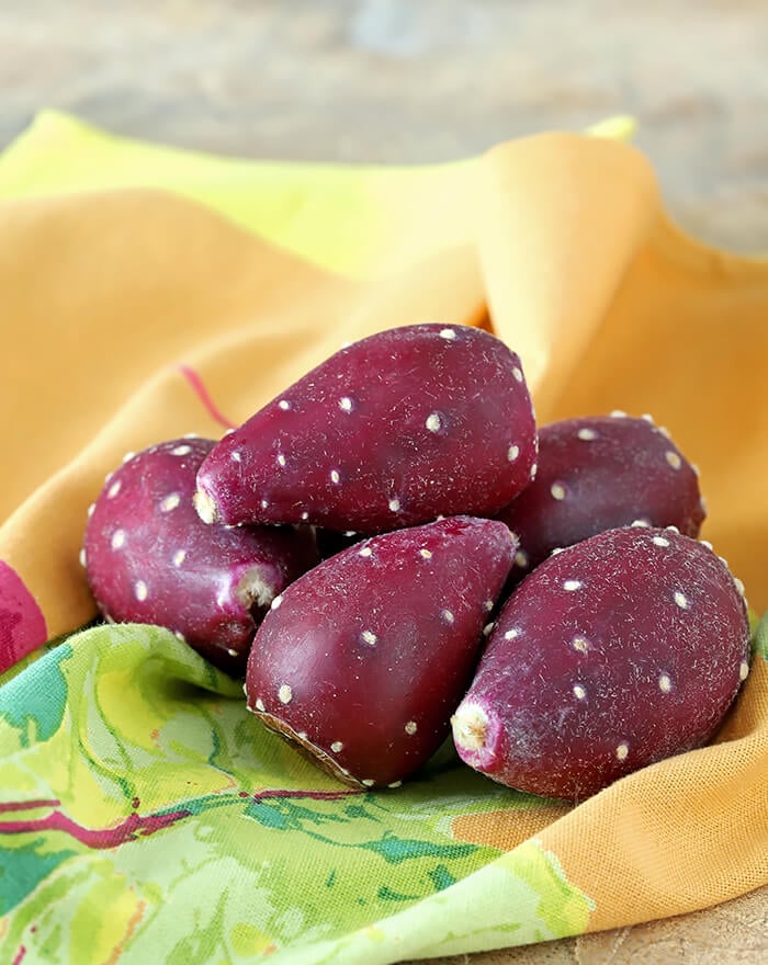 Prickly Pear Cactus Fruit on a Peach, Green, and Purple Towel