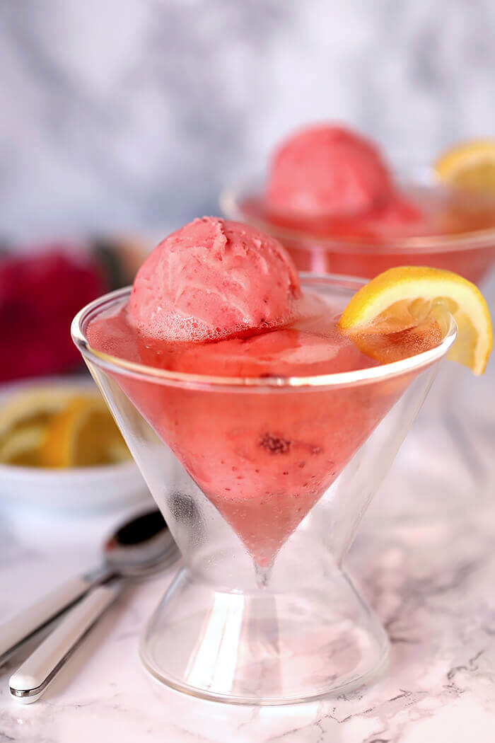 Raspberry Lemonade Wine with Sherbet Served in a Martini Glass and Garnished with Lemon and Served in a Martini Glass