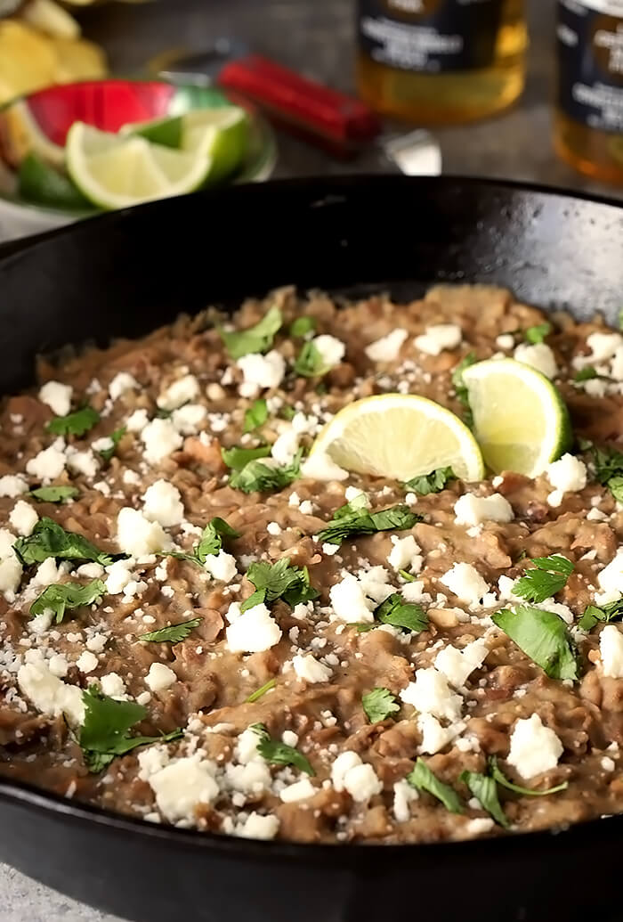 The Best Re-Fried Beans with Bacon Garnished with Queso Fresco Cheese and Cilantro