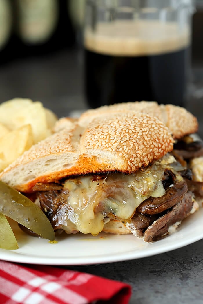 Closeup of Steak and Cheese Sandwich with Caramelized Onions and Mushrooms