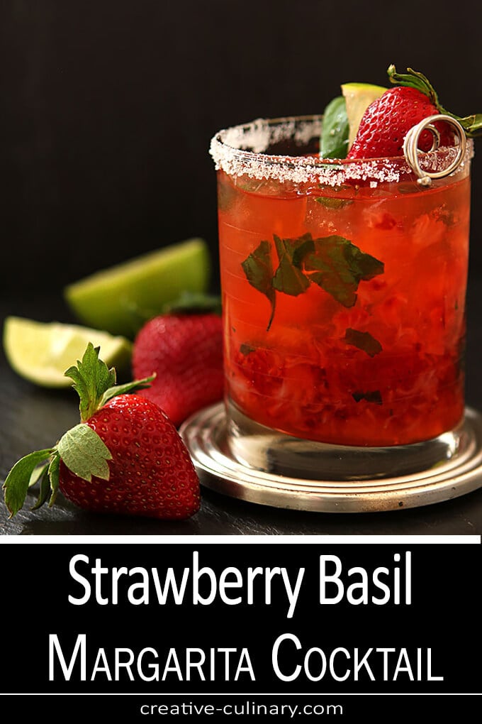Strawberry Basil Margarita Cocktail served in a lowballl glass with strawberry garnish.