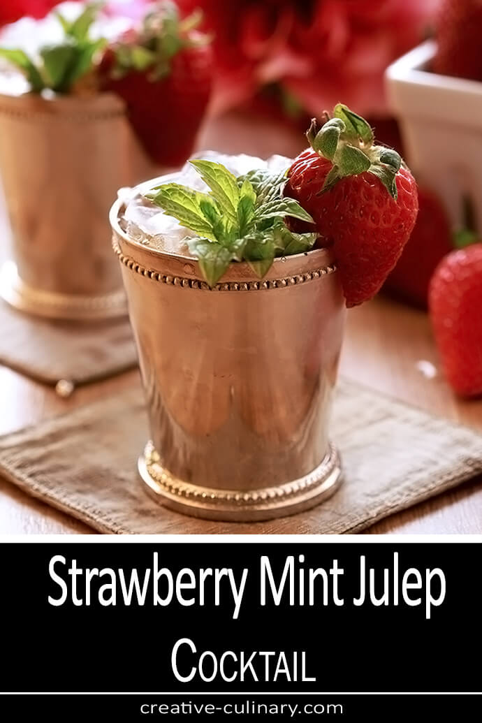 Strawberry Mint Julep Cocktail in a Silver Julep Cup with Mint and Strawberry Garnish