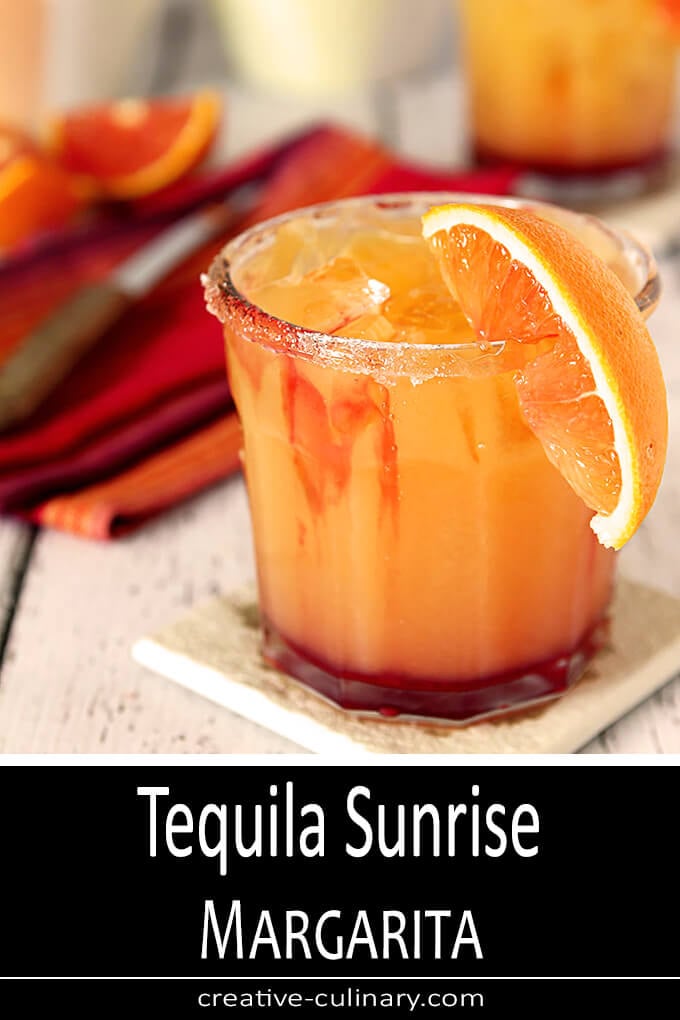 Tequila Sunrise Margarita in a Glass with Orange Segment Garnish