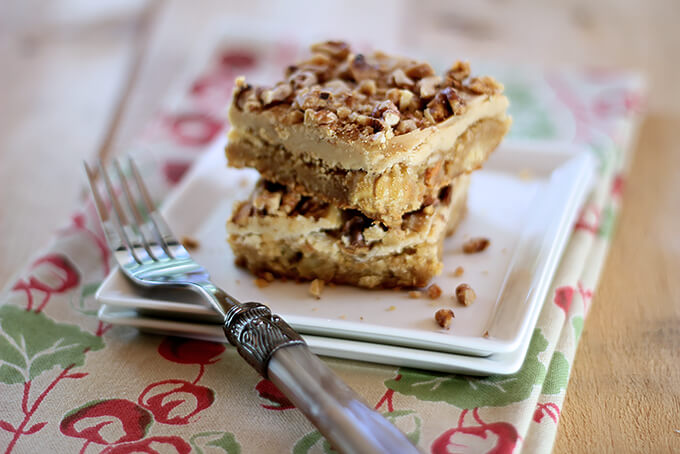 Toffee Apple Bars with Caramel Frosting on a Square WHite Serving Plate