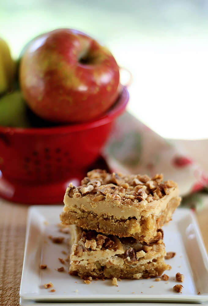 Toffee Apple Bars with Caramel Frosting Served on a White Plate