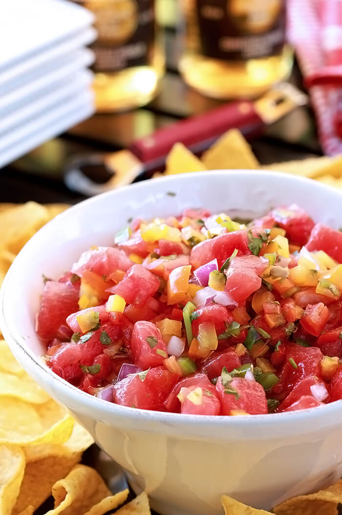Watermelon Salsa (Pico de Gallo) Closeup of dish with watermelon, red, orange, and yellow bell peppers, and jalapeno mixed with honey.
